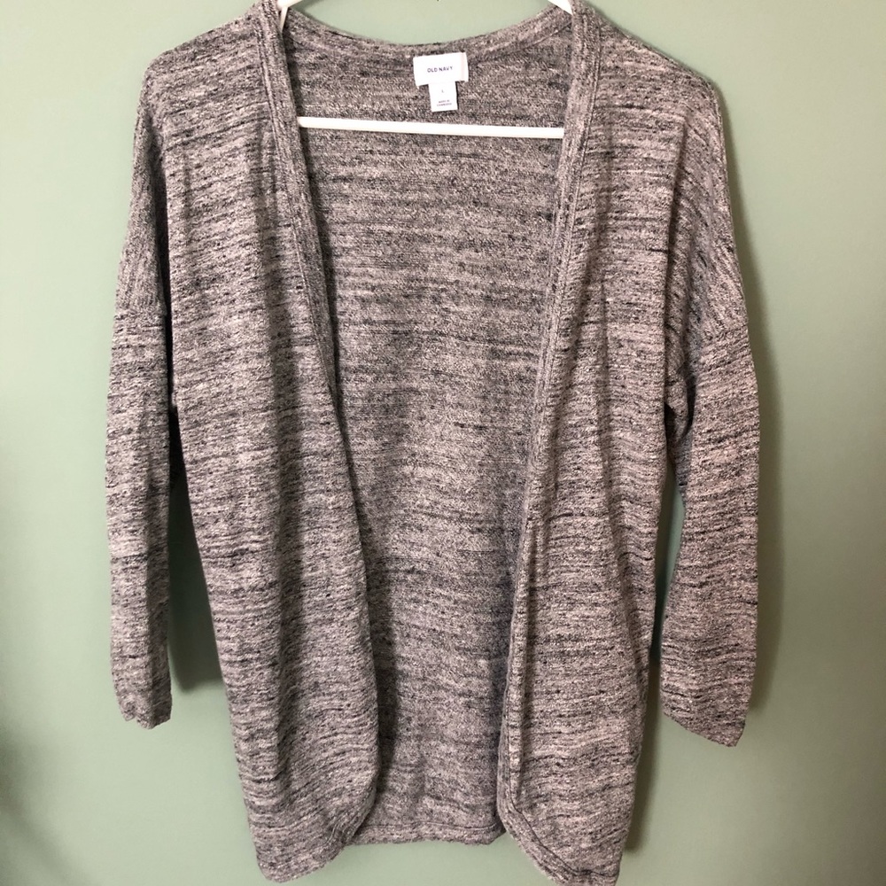 Grey cardigan with black and light grey spots.